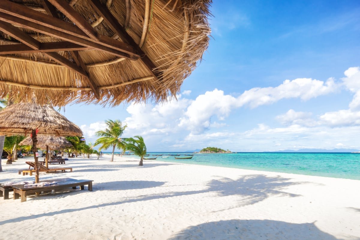 Beach cabanas on white sand in Koh Lipe, Thailand