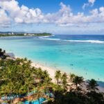 Breathtaking View of Tumon Bay with Clear Blue Waters and Palm Trees in Guam